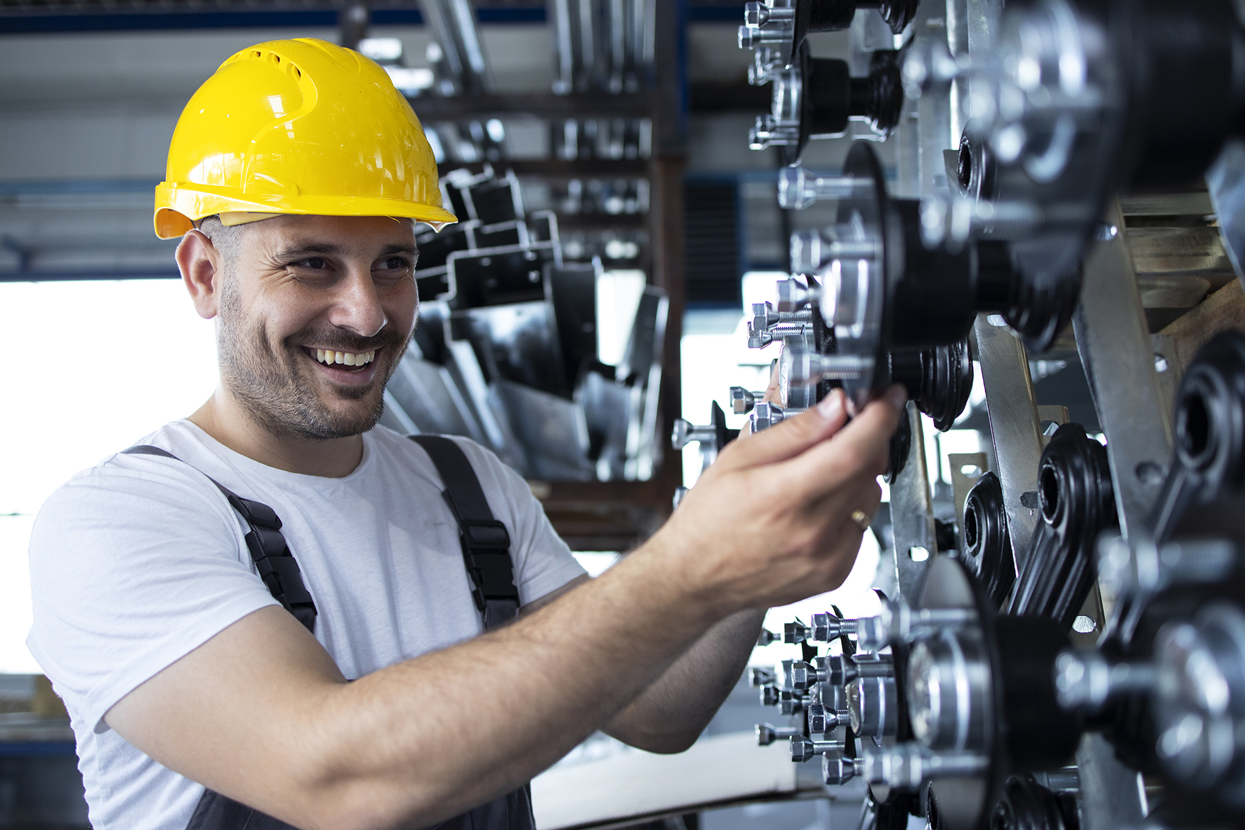 Industrial worker working at production line in factory.